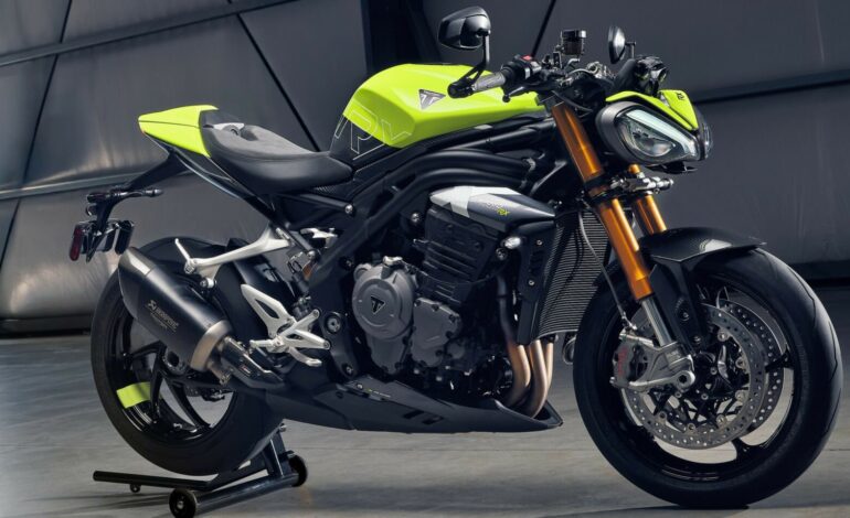 Triumph Speed Triple 1200 RX side view showcasing its sporty design and neon yellow-black color scheme.